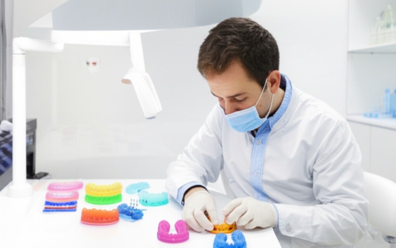 Dental professional with 3D printed dental products