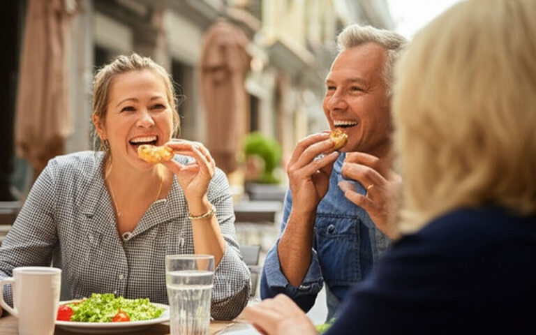 Couple enjoying a meal at an outdoor cafe