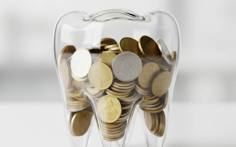 Clear tooth-shaped piggy bank